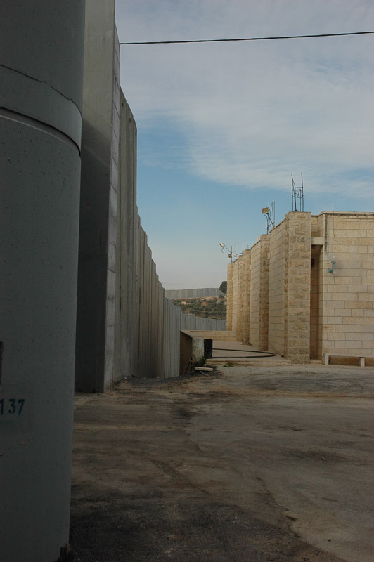 Bethlehem is enclosed by a 26 ft concrete wall. It snakes in and out separating houses, and families.