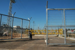 Mas'ha is enclosed by a separation fence, the other side an Israeli settlement in the West Bank.