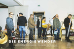 People of all various ages from the Germany village Hausbay in Rhineland-Palatinate are standing in line the village's community centre to exchange their old light bulbs with LED lights.