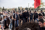 People are mourning during the burial of a female PKK fighter in Diyarbakir in Turkey