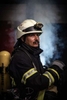 A member of the voluntary firefighters of the city of Königstein in Germany is posing for a portrait inside the firefighter's headquarters