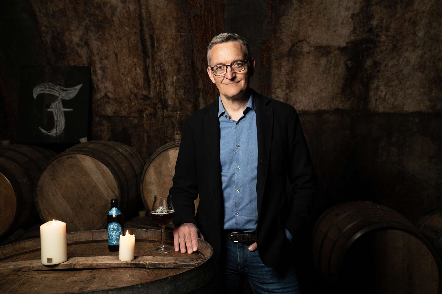 Johannes Faust, CEO of Brauhaus Faust, is standing in the historic beer cellar of his company's headquarter in Miltenberg in the German state of Bavaria
