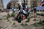 After a protest Salafist men are sitting at Tahrir Square in downtown Cairo in Egypt