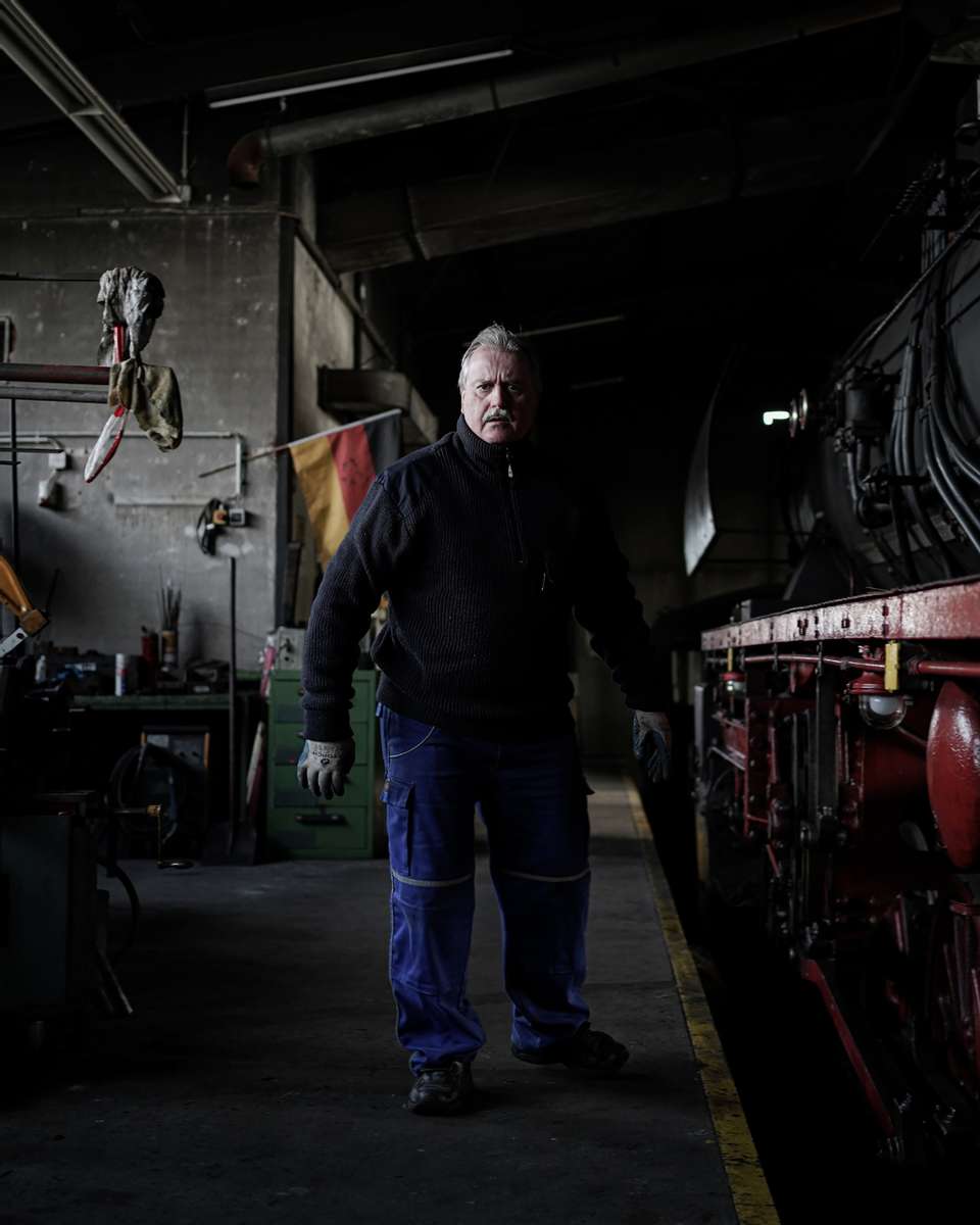 A volunteer working for the Frankfurt based club {quote}Historische Eisenbahn{quote} while maintaining one of the club's historic steam trains