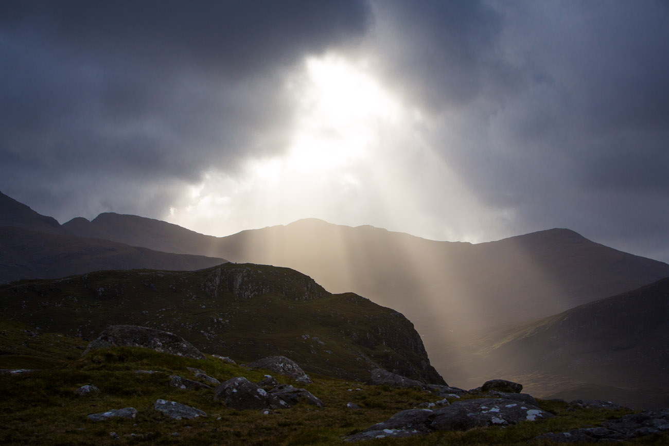 shaft of light in the mountains. Moody shot of angel rays on a stormy day. 