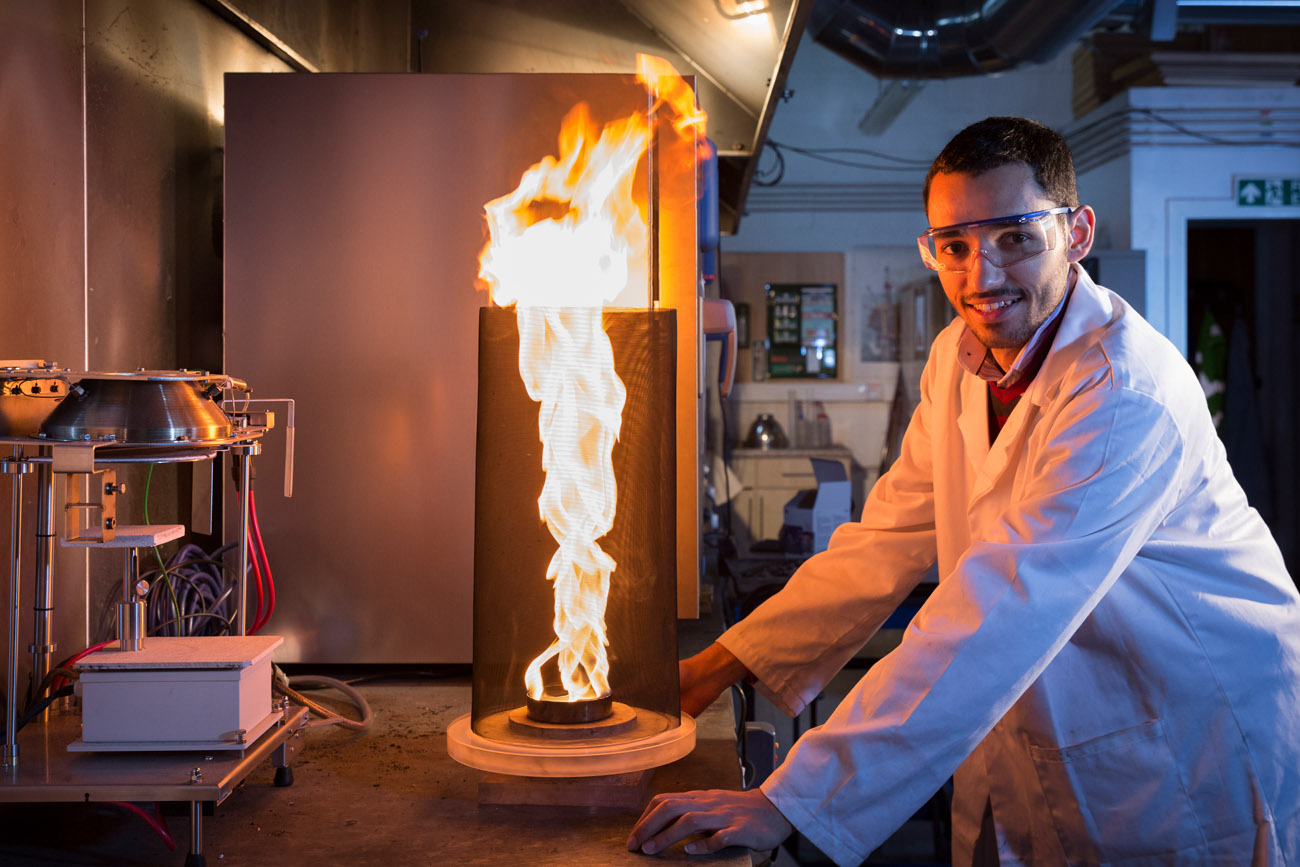 Student studying at Edinburgh University with a firenado in a lab