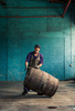 Havana Club cooper moving a barrel of Rum
