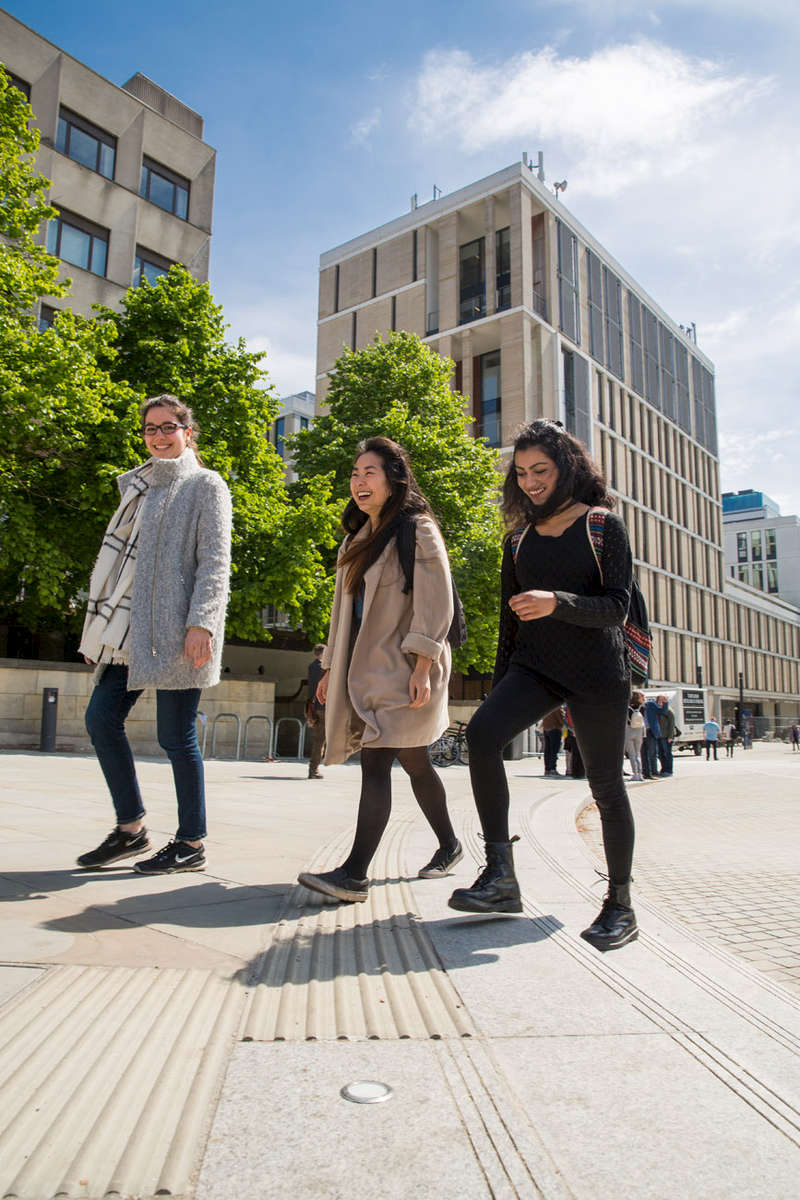 Students studying at Edinburgh University in Bristo Square.