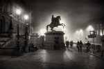 silhouette of a statue of a man on a horse. Edinburgh Princes Street on a foggy night