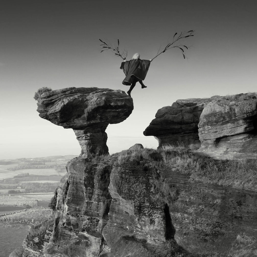 woman leaping off the Bunnet stane in Fife with home made wings