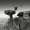 woman leaping off the Bunnet stane in Fife with home made wings