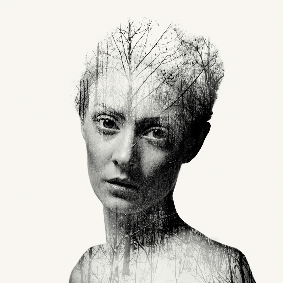 nude double exposure of a woman with branches