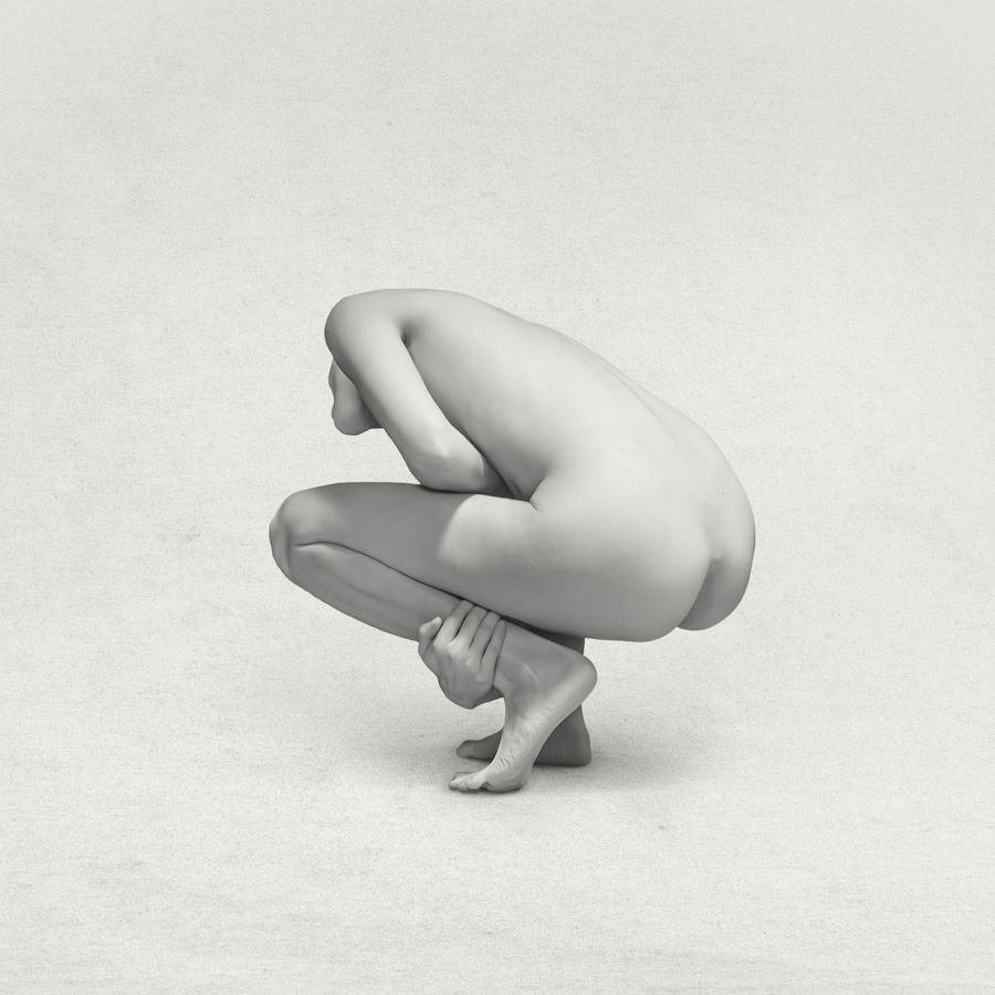 crouching abstract naked girl in a studio in Black and white. Fine art print