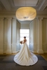 Captivating portrait of a bride on her wedding day at Flood Mansion in San Francisco. The bride, wearing an exquisite gown, exudes grace and happiness. With the historic elegance of Flood Mansion as the backdrop, this image encapsulates the bride's beauty and the timeless charm of her wedding day.