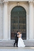 Intimate portrait of a bride and groom in front of the iconic Flood Mansion in San Francisco. The bride's gown and the groom's attire exude sophistication and romance. Against the backdrop of the stately mansion, this image captures the couple's love and the grandeur of their wedding day.{quote}