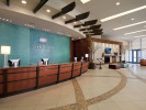 curved reception desk and floor patterns in hotel lobby
