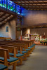 sanctuary toward alter with stained glass above