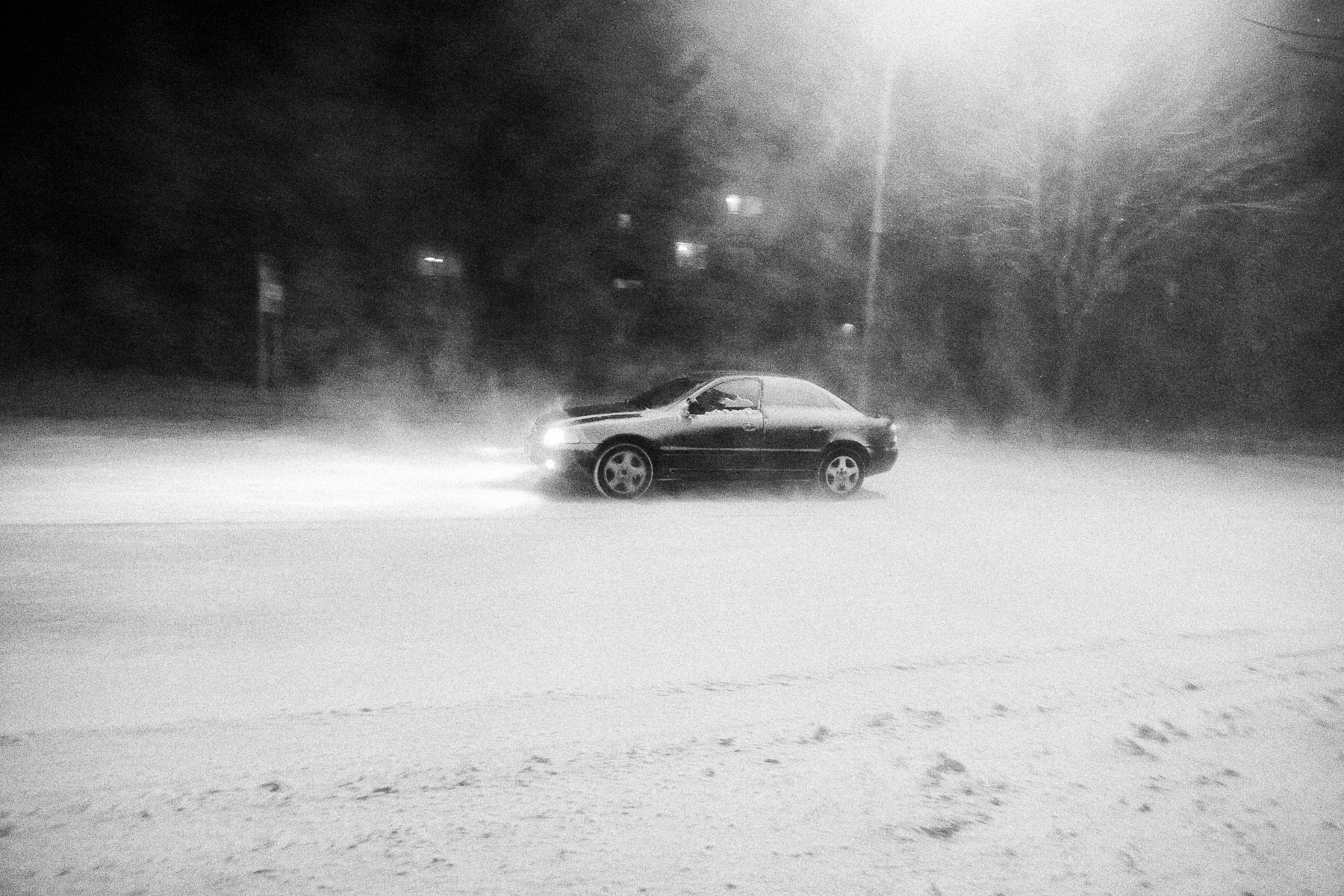 A car makes his way through the blizzard in Ajdovščina, Slovenia, March 10, 2010.