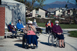 Seniors of dr. Janko Benedik nursing home in Radovljica, Slovenia, listen to a zitherist play outside the nursing home on April 16, 2020. Nursing homes face biggest difficulties in times of the coronavirus outbreak, because the elderly are at greatest risk of developing a life-threatening condition. Concerts like these brighten up their days in  quarantine.