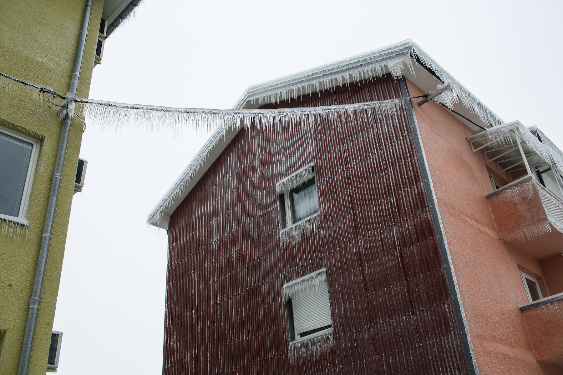 A facade of an apartment building is covered in more than 5 cm of ice in Postojna, Slovenia, February 5 2014.