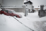 A broken power line cable and frozen vehicles are seen in Postojna, Slovenia, February 5 2014.