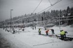 Workers clear ice from the rails on the heavy damaged train station in Postojna, Slovenia, February 5 2014.