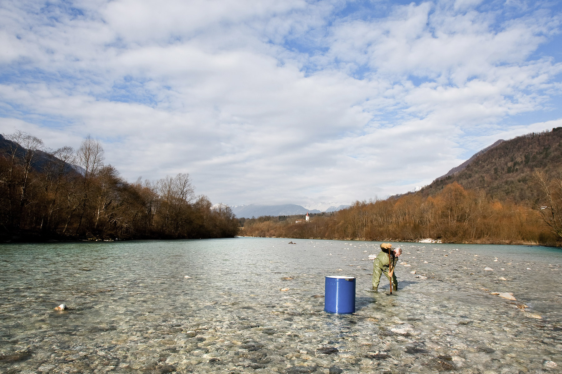 Fishkeeper Zoran Kocič digs a nest in the middle of Soca river to insert eyed eggs. Only hybrids prevail in Soca, but they keep stocking it with pure Marble trout to study the way Marble trout mixes with Brown trout, and to try and raise the level of pure DNA in hybrids.