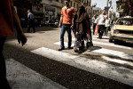 A couple crosses the street in Cairo, Egypt, May 3, 2008.