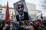 A protester carries a poster of prime minister Janez Jansa as a zombie during the third countrywide uprising against the government in Ljubljana, Slovenia, on February 8, 2013.