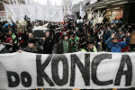 Protesters carrying a coffin to symbolically bury the state march in front of a banner that reads {quote}Till the end{quote} during the fourth country-wide uprising against the political elites in Ljubljana, Slovenia, on March 9, 2013.