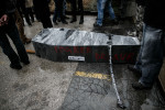 A coffin symbolizing a funeral of the state lies on the ground in front of the courthouse during the fourth country-wide uprising against the political elites in Ljubljana, Slovenia, on March 9, 2013.
