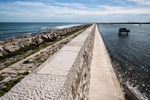 A strong high wall called the Murazzi stretches some 20 km along the barrier island of Pellestrina to protect the lagoon from open sea and the waves that come with storms. The wall was built over two hundred years ago and was restored in the 1970s.