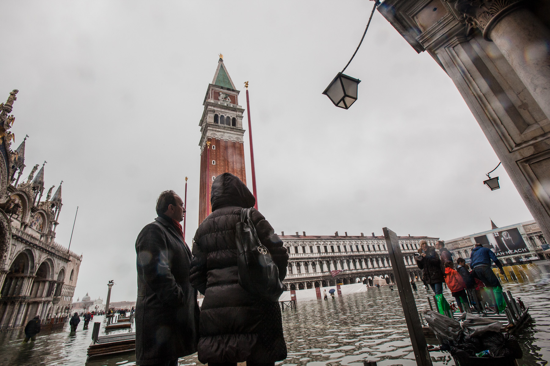 Tourists wade through high water in San Marco Square in Venice, November 1, 2012.