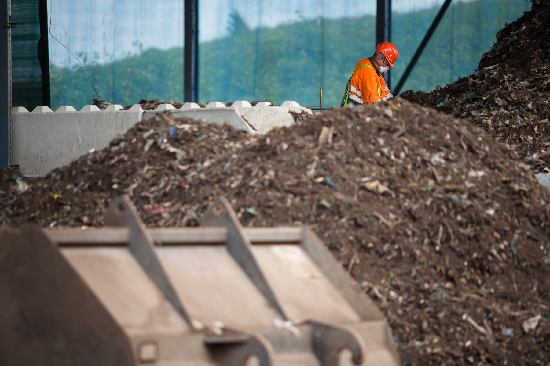 A worker inspects composting bio waste  at the RCERO Ljubljana recovery plant.