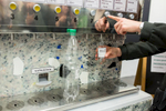 A customer uses one of two packaging-free vending machines called BERT  that offers 18 liquid products in Ljubljana, May 8, 2019.