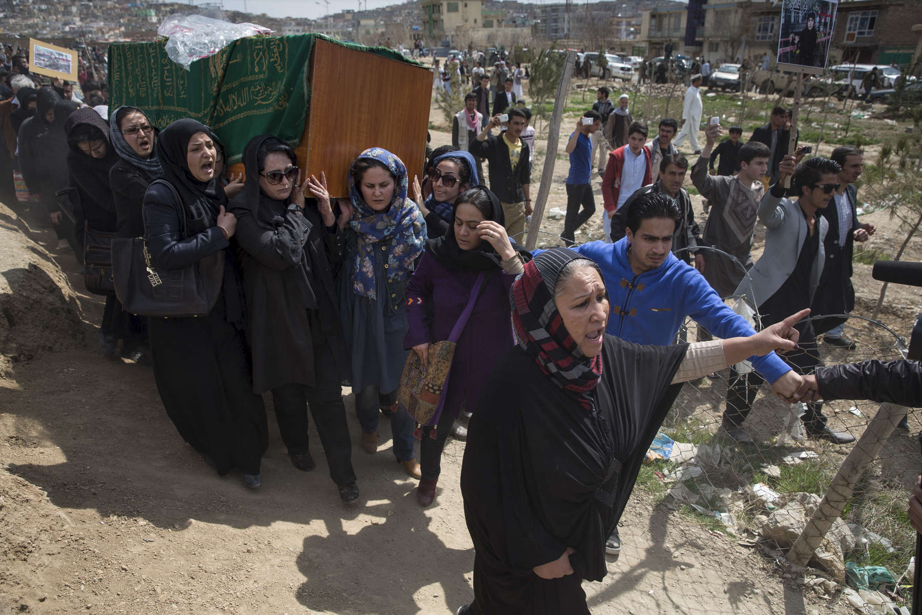 KABUL, AFGHANISTAN - MARCH 22, 2015:  Relatives friends and women\'s rights activists carry the casket of Farkhunda , 27, who was killed by a mob in the center of Kabul and was violently beaten and set on fire onThursday. She was attacked for allegedly burning a copy of the holy Quran which was false. Kabul police have detained nine people related to Farkhnuda’s case. President Ashraf Ghani has appointed a delegation to probe the incident. The Imam of Wazir Akbar Khan Mosque was denied permission to take part at Farkhunda’s funeral following his remarks on her death.(Photo by Paula Bronstein/ for the Wall Street Journal)