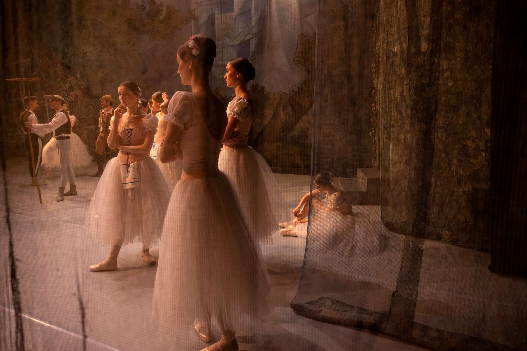 LVIV, UKRAINE - Ballet dancers are seen onstage before the ballet performance Giselle begins June 10, 2022 in Lviv, Ukraine. The Lviv National Opera house started performances last month for both ballet and opera.The bomb shelter can only hold 300 people so tickets are limited incase a siren goes off during the performance. (Photo by Paula Bronstein /Getty Images)