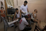 GAZA CITY, GAZA STRIP- MAY 23,2018 Doctors Worldwide,a Turkish ngo gives medical treatment to gunshot victims inside their homes on May 23,2018 in Gaza city, Gaza strip. The world’s largest open air prison along the Israel-Gaza border. Everyone is well aware that Gaza's two million inhabitants are trapped in a cycle of violence and poverty, created by policies and political decisions on both sides. The problems and complications affecting Gaza today are overwhelming. The world, seemingly accustomed to the suffering of the Gazan people turns a blind eye. (Photo by Paula Bronstein ) 