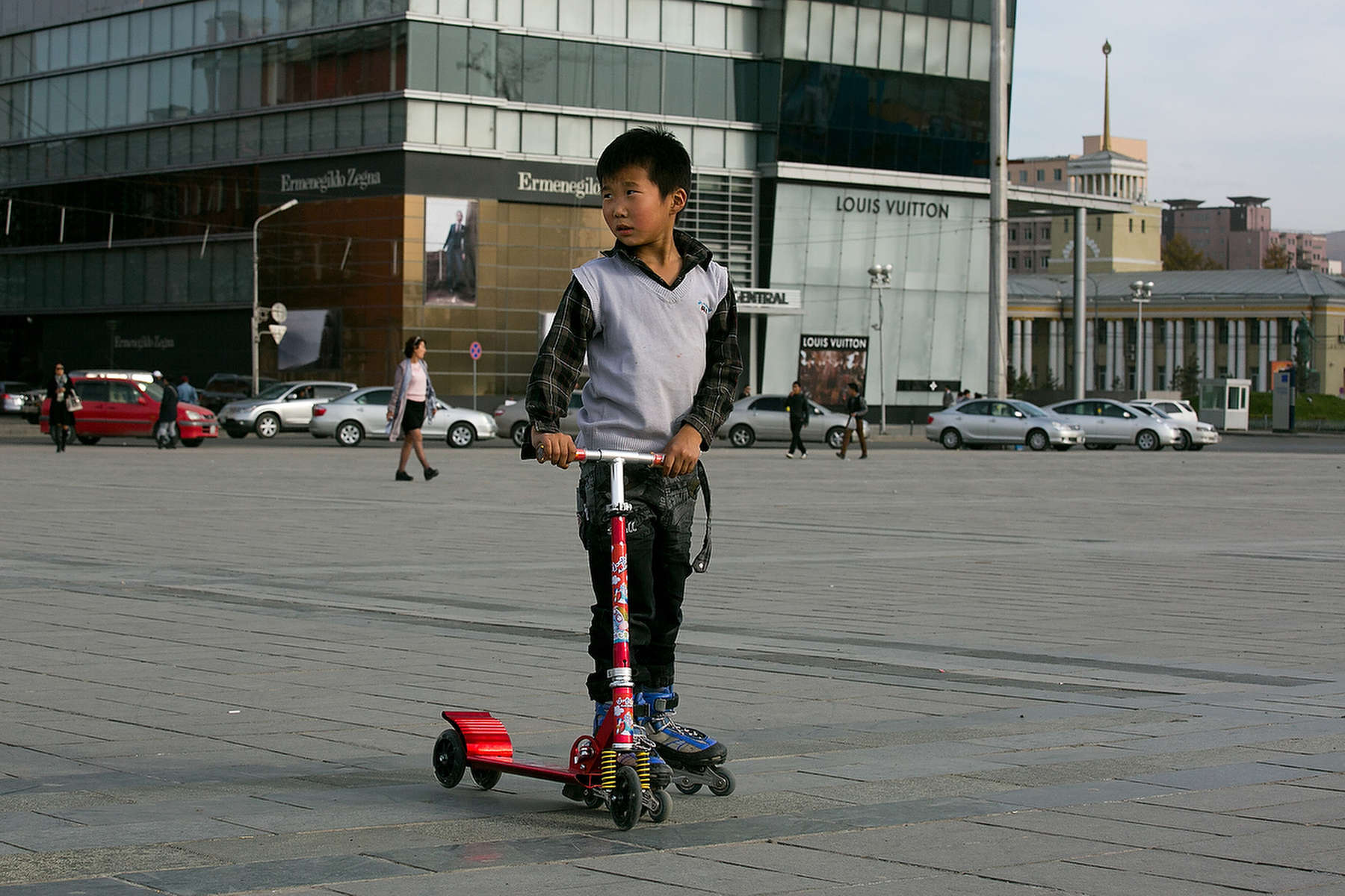 ULAANBATAAR, MONGOLIA - OCTOBER 18: A Mongolian boy on rollerblades hangs out at Sukhbataar Square October 18, 2012 Ulaanbataar, Mongolia. Some 100 years ago, Mongolia gained independence from Qing China, and more than 20 years ago it removed itself from the Soviet Bloc. Since then, the country has been undergoing massive social, economic and political changes. The Oyu Tolgoi, the copper and gold mine is Mongolia’s biggest foreign investment project to date adding an estimated 35% value to the country’s GDP. Mongolia is a land of amazing contrasts and is the most sparsely populated country on earth with fewer than 3 million people. (Photo by Paula Bronstein/Getty Images)