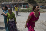 Sindhupalchok District , Nepal -May 12, 2015: People scream as the 7.3 earthquakes hits the Tatopani area causing numerous landslides. Photo by Paula Bronstein for IFRC ( International Federation of Red Cross) Wall Street Journal)