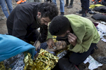 LESBOS, GREECE - OCTOBER 30: Israeli Doctor Essam Daod (left) gives CPR to a refugee who later died after being rescued from the open waters of the Aegean sea on the island of Lesbos, Greece on October 30, 2015. The man died despite the efforts of the lifeguards and medical personnel to revive him. Dozens of rafts and boats are still making the journey daily over 590,000 people have crossed into the gateway of Europe. Nearly all of those are from the war zones of Syria, Iraq and Afghanistan. (Photo by Paula Bronstein)