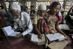 Rohingya girls study at a religious school teaching daily classes in Islamic studies at the Say Tha Mar Gyi IDP camp.( Photo by Paula Bronstein/ For The Washington Post )