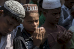 SITTWE - MARCH 6:  At a local mosque men and boys join in Friday prayer, a very important weekly practice for the Muslim Rohingya at the IDP camp. In 2012, sectarian violence between the Rohingya, who are Muslim and ethnic Rakhine Buddhists killed at least 200 people and made 140,000 homeless, most of them are Rohingya.