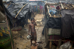 THAINKHALI, BANGLADESH - OCTOBER 7: A Rohingya boy cries as monsoon rains continue to batter the area causing more difficulties October 7, Thainkhali camp, Cox's Bazar, Bangladesh. e. 