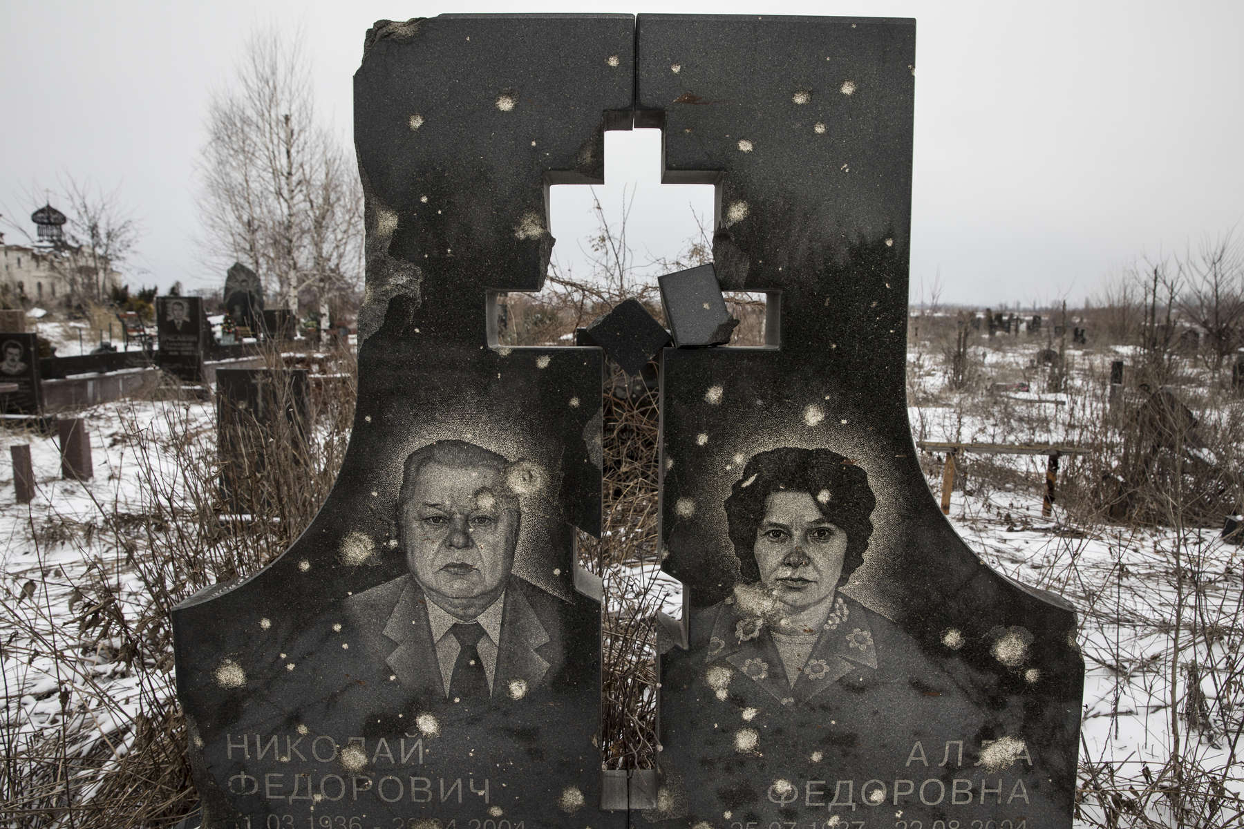 A war-torn cemetery full of tombstones that have been hit by gunfire at the devastated neighborhood near the Donetsk airport.After more than four years of war the armed conflict in eastern Ukraine has a human toll that is staggering. The war has displaced more than 1.6 million with over 2,500 civilians killed and 9,000 injured. Some 200,000 people live under constant fear of shelling every day, with nearly a third of the 3.4 million people in need of humanitarian assistance over 60 years of age. Ukraine has the highest proportion of elderly affected by war in the world.