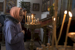 A woman lights candles during a Sunday service at a church in Donetsk.After more than four years of war the armed conflict in eastern Ukraine has a human toll that is staggering. The war has displaced more than 1.6 million with over 2,500 civilians killed and 9,000 injured. Some 200,000 people live under constant fear of shelling every day, with nearly a third of the 3.4 million people in need of humanitarian assistance over 60 years of age. Ukraine has the highest proportion of elderly affected by war in the world.