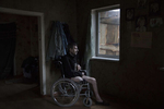 Avdiivka: Vladimir Mamoshyn, age 65, sits in his wheelchair, his wife died in 2010, now he lives alone his children abandoned him. He resides in the war-torn  Avdiivka village, less than a kilometer from the contact line where daily shelling and gunfire can be heard. In 2016, Vladimir lost his leg due to a vascular disease, with poor access to health facilities along with inadequate health care. After having a heart attack a few months later in 2017 he lost the use of his left hand, now he lives in a wheelchair depending on family and  friends to help him.