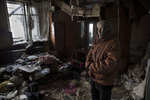 Donetsk,  Donetsk People's Republic (DPR):Antonina Kondratiyevna, 77, stands in her neighbor's home, destroyed during heavy battles between Ukrainian army and pro-Russian militia in 2014-2015. She and her elderly sister are among few residents living in the devastated neighborhood near Donetsk airport.After more than four years of war the armed conflict in eastern Ukraine has a human toll that is staggering. The war has displaced more than 1.6 million with over 2,500 civilians killed and 9,000 injured. Some 200,000 people live under constant fear of shelling every day, with nearly a third of the 3.4 million people in need of humanitarian assistance over 60 years of age. Ukraine has the highest proportion of elderly affected by war in the world.