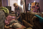 Mayorsk, Donetsk regionAntonina Malna, age 84, gets cared for by a local nurse, she had a stroke a few months ago and remains in a comatose state while her daughter Zoya watches. The nearest hospital is 25 km away and cannot afford to provide 24h care for patients like Antonina due to the lack of medical staff. Mayorsk is right on the border area in Eastern Ukraine, a very difficult location for the elderly to be unless they have medical and family support. 