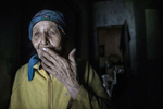 Opytne, Eastern Ukraine:  Mariya Gorpynych, age 76, lives alone. She speaks with tears in her eyes while talking about the death of her son and her husband. Her son Victor,48, was fatally injured by shelling near the home in 2016, he died in her arms. Then her husband, died in the same year from a heart attack caused by extreme stress. Mariya refuses to leave her village because her family are buried near by.{quote}I have nowhere to flee, my whole family is buried here.{quote}  {quote}I got used to the continued shelling.{quote} Opytne is a war torn village on the contact line where only 43 people are left due to the dangers. 